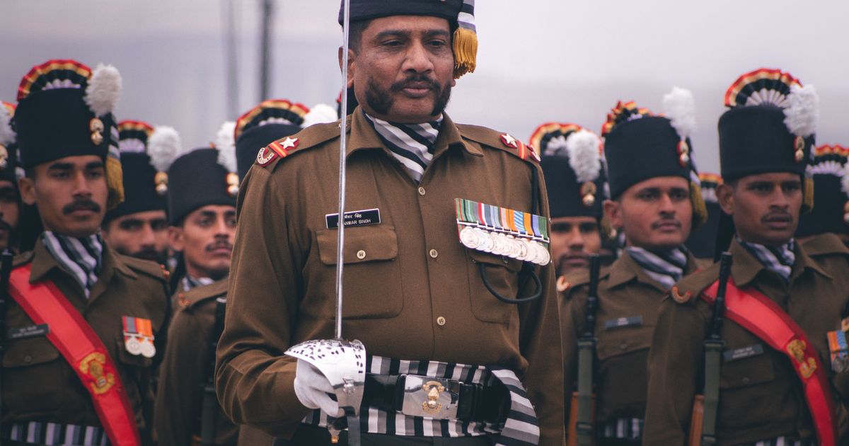 Decorated Indian Army officer with medals leading a ceremonial parade